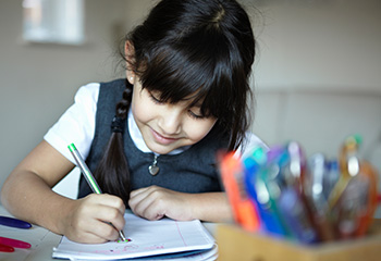 Little girl writing