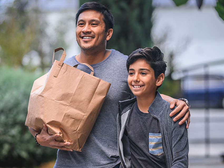Refugee child in the arms of his foster parent